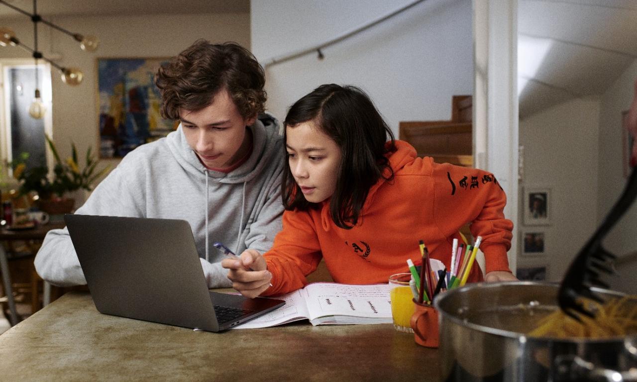 Two teenagers doing homework together