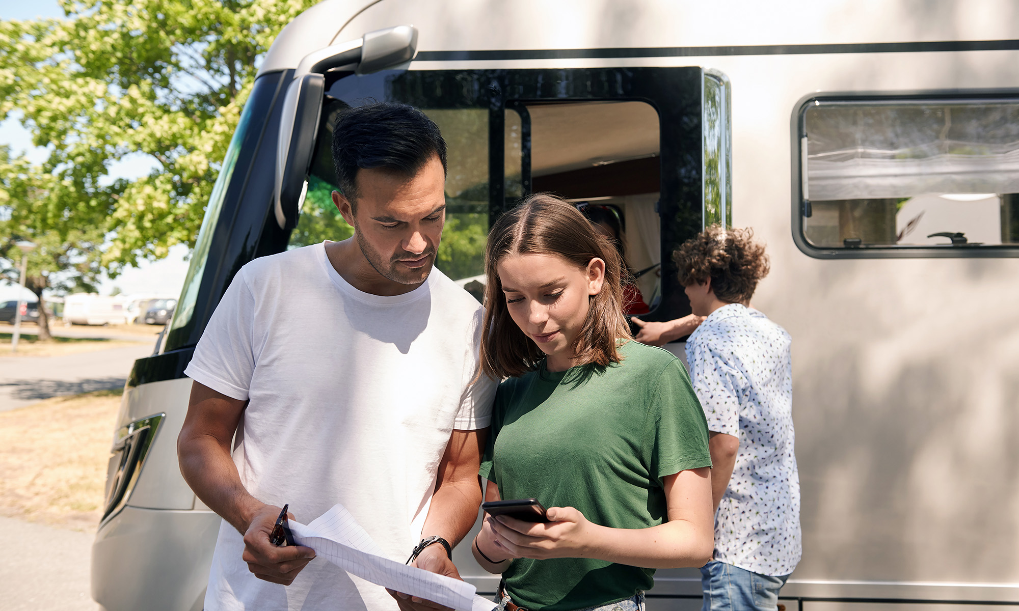 Couple in front of a camper van